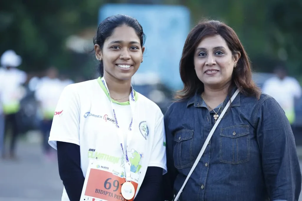 Two women at a running event.