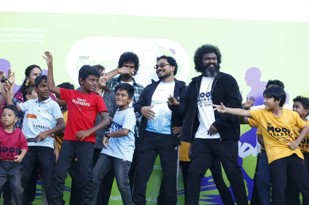 Children performing on stage together.