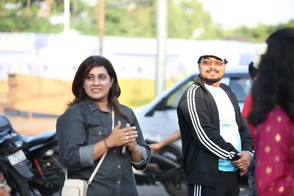 People interacting at outdoor event.