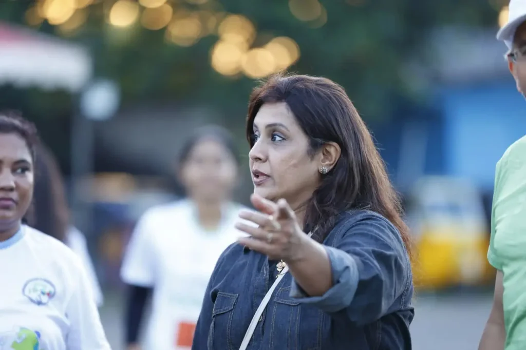 Group discussing at outdoor event.